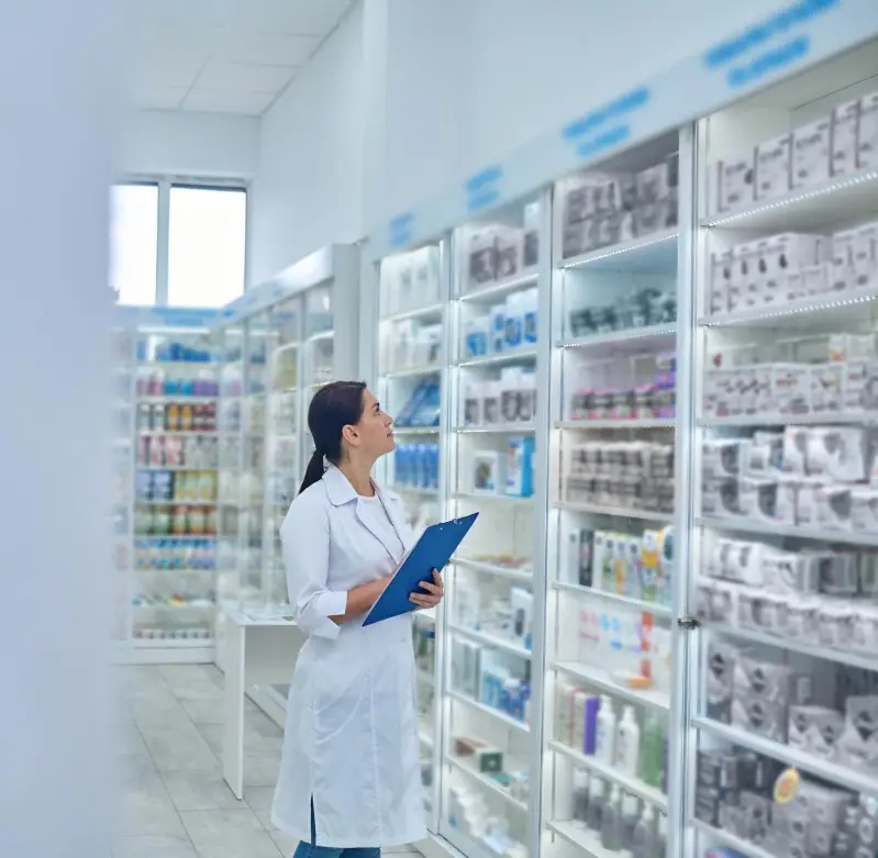Pharmacist checking medicines in a drugstore
